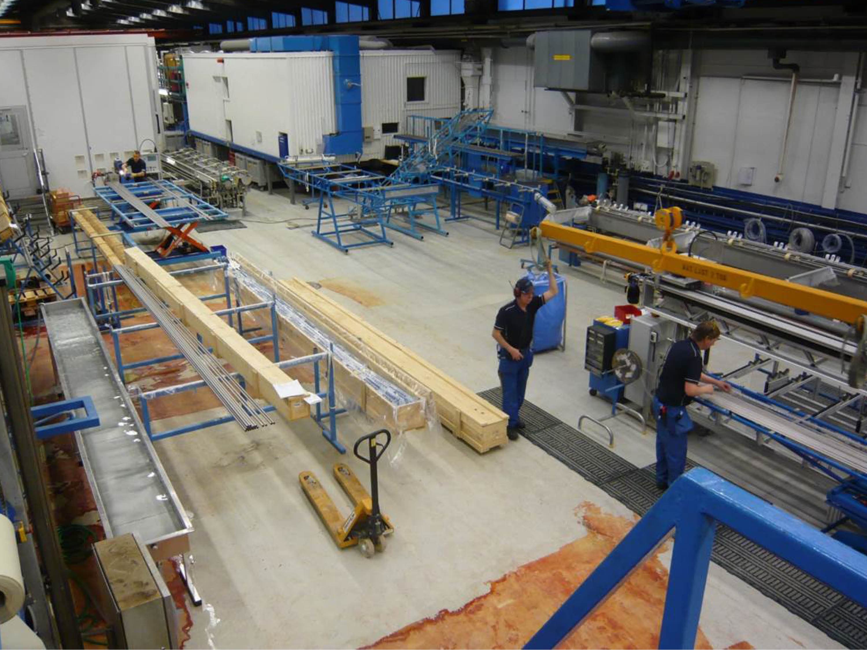 Photo of an old production area with crates and tubes