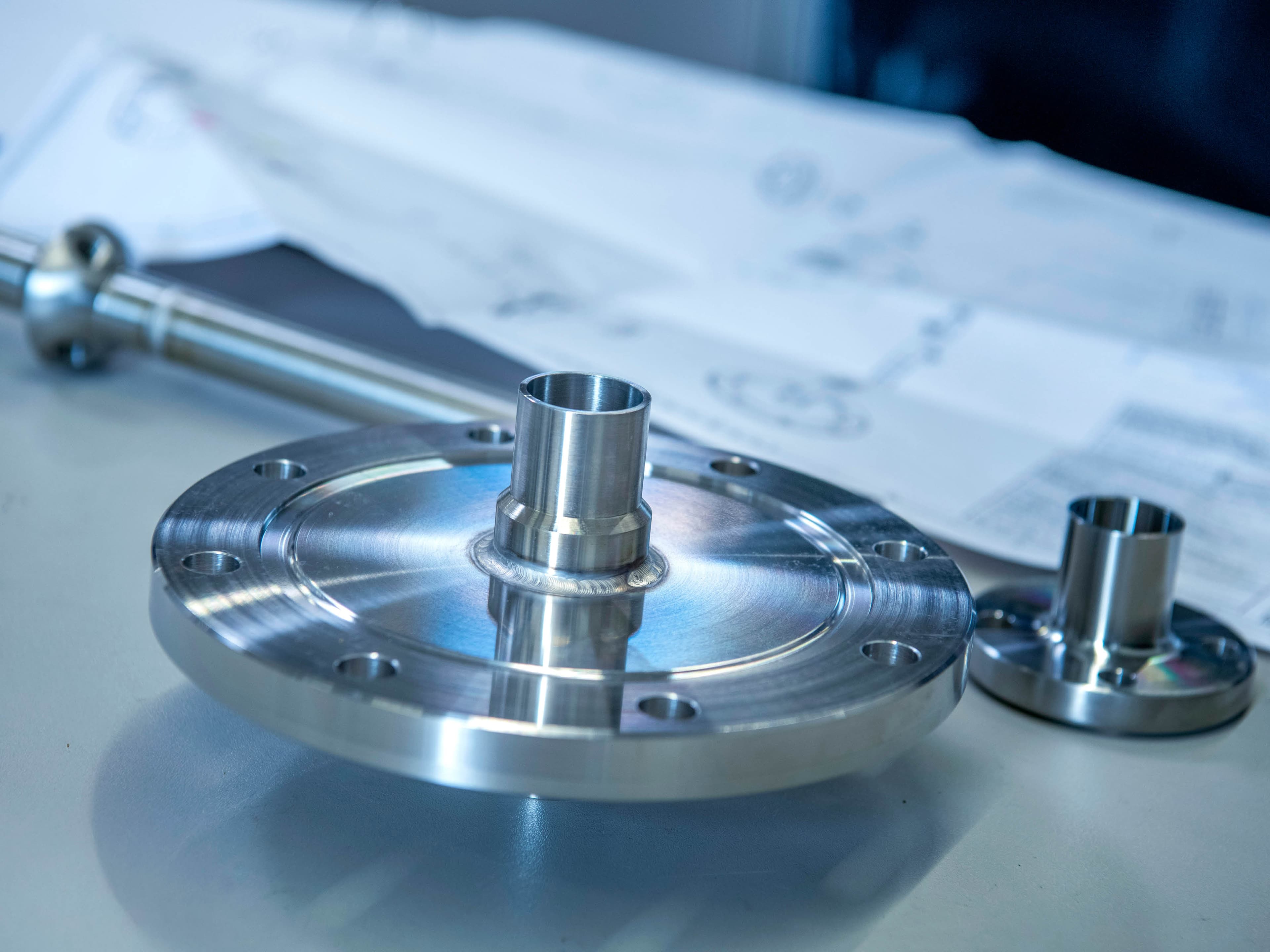 Custom-made stainless steel; technical drawing in the background