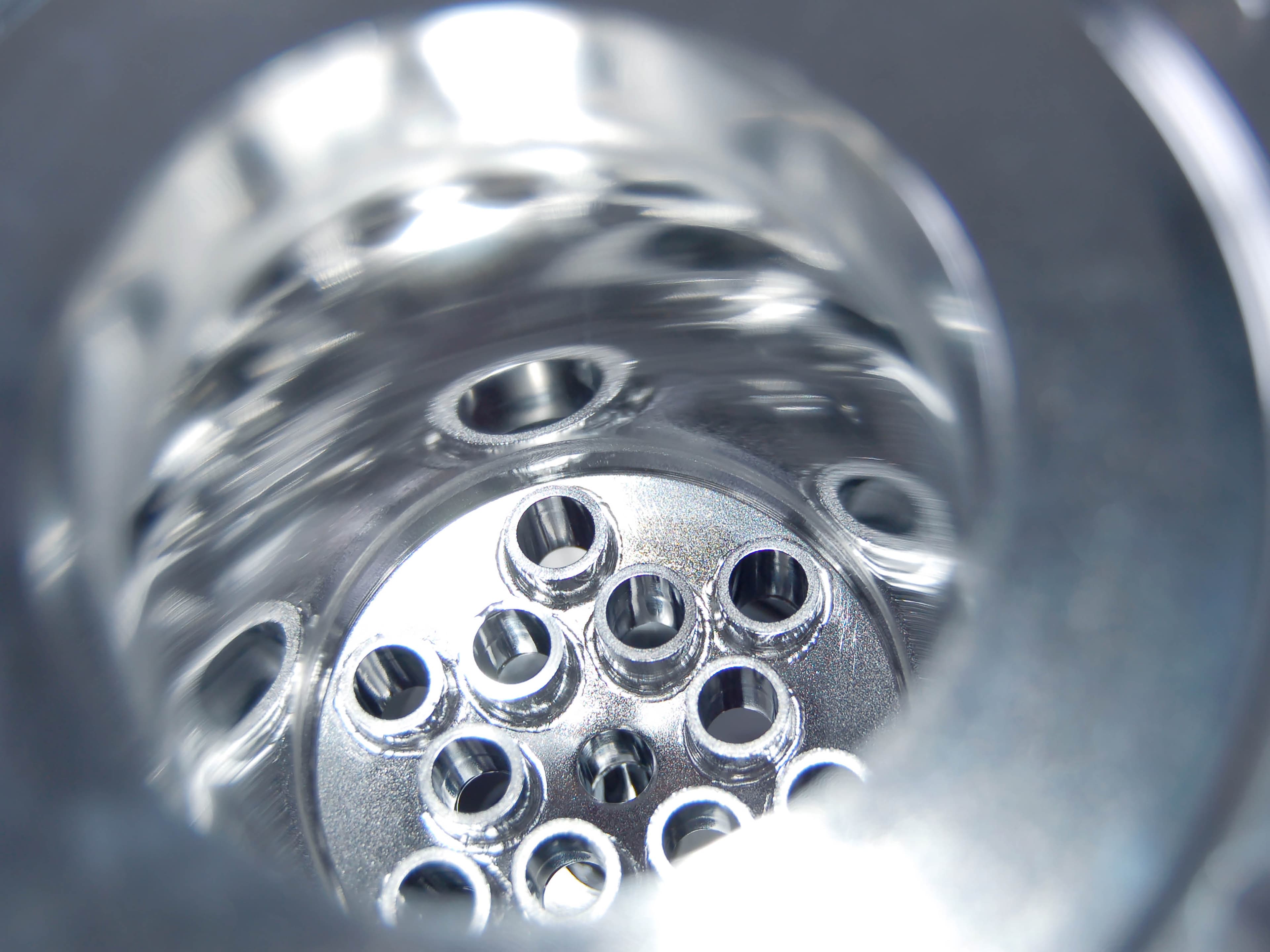 stainless steel container with closely spaced outlets on the inside