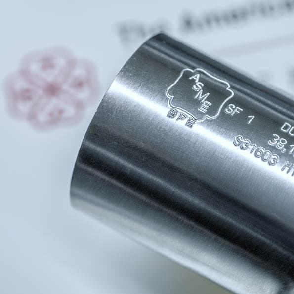 Stainless steel component with engraved ASME BPE symbol
